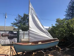 Blue-Boat-with-Sail.webp